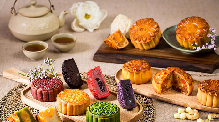 Mooncakes are ornately-decorated pastry blocks baked to golden brown and filled with untold flavors